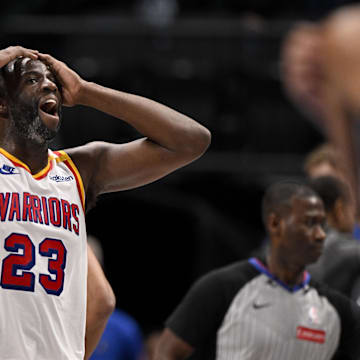 Feb 12, 2025; Dallas, Texas, USA; Golden State Warriors forward Draymond Green (23) reacts to a foul call on three point attempt by Dallas Mavericks guard Kyrie Irving (not pictured) during the fourth quarter at the American Airlines Center. Mandatory Credit: Jerome Miron-Imagn Images