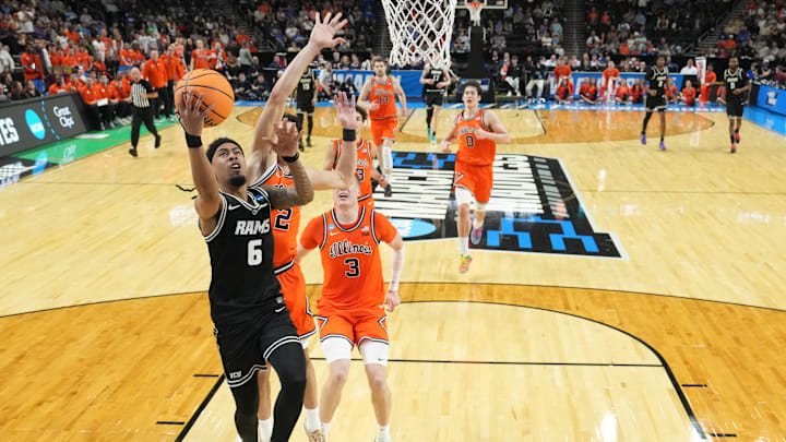Mar 21, 2026; Greenville, SC, USA; VCU Rams guard Terrence Hill Jr. (6) shoots as Illinois Fighting Illini guard Andrej Stojakovic (2) and forward Ben Humrichous (3) defend in the second half during a second round game of the men's 2026 NCAA Tournament at Bon Secours Wellness Arena. Mandatory Credit: Bob Donnan-Imagn Images