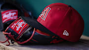 Jun 7, 2023; Washington, District of Columbia, USA; A general view of an Arizona Diamondbacks hat and Rawlings glove in the dugout during the fifth inning of the game against the Washington Nationals at Nationals Park. 