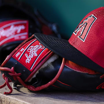 Jun 7, 2023; Washington, District of Columbia, USA; A general view of an Arizona Diamondbacks hat and Rawlings glove in the dugout during the fifth inning of the game against the Washington Nationals at Nationals Park.