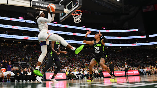 A photo of Kahleah Copper making a hustle play