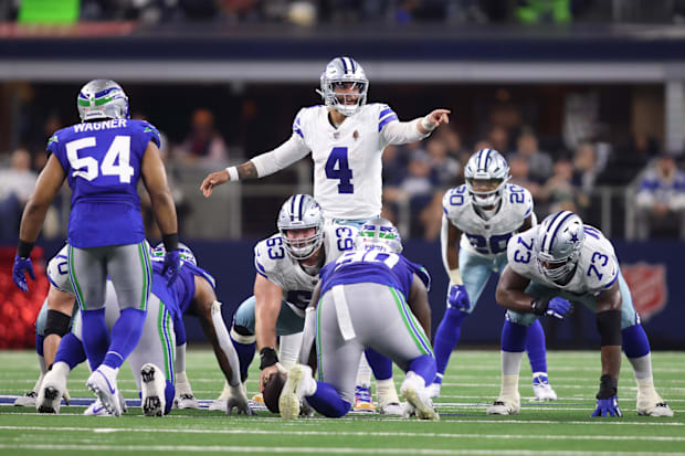 Dallas Cowboys quarterback Dak Prescott gestures at the line of scrimmage during the first half against the Seattle Seahawks.
