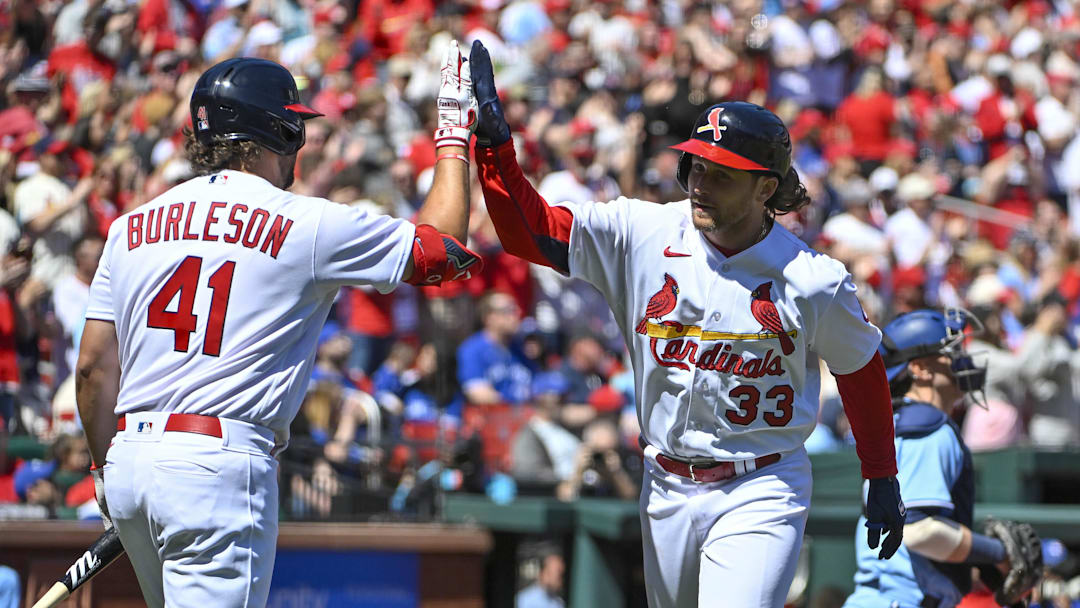 Apr 2, 2023; St. Louis, Missouri, USA;  St. Louis Cardinals second baseman Brendan Donovan (33) celebrates with left fielder Alec Burleson (41) after hitting a solo home run against the Toronto Blue Jays during the first inning at Busch Stadium. Mandatory Credit: Jeff Curry-Imagn Images