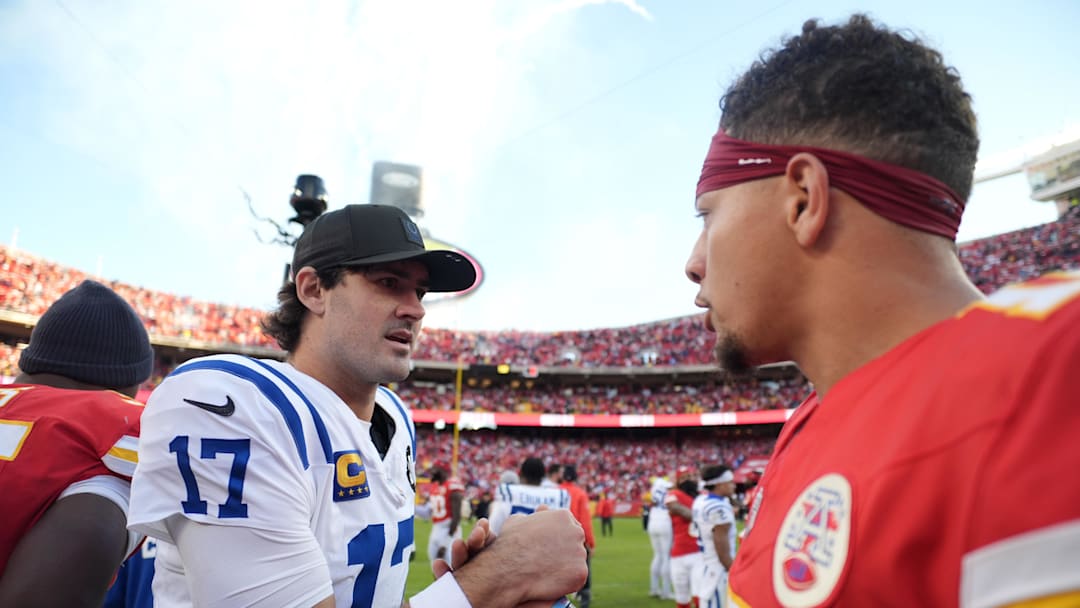 Nov 23, 2025; Kansas City, Missouri, USA;  Indianapolis Colts quarterback Daniel Jones (17) and Kansas City Chiefs quarterback Patrick Mahomes (15) meet on field after the game at GEHA Field at Arrowhead Stadium. Mandatory Credit: Jay Biggerstaff-Imagn Images