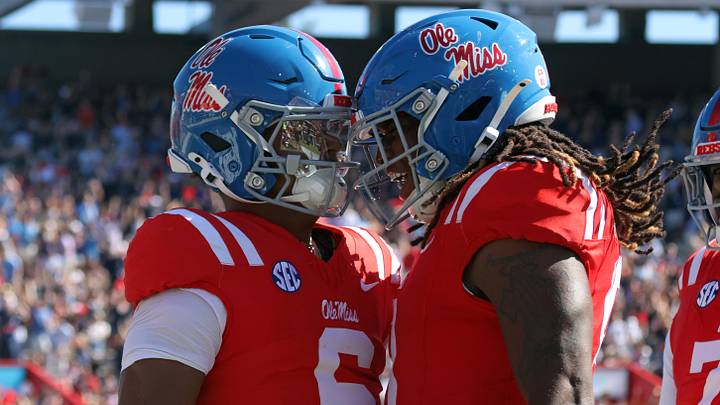 Oct 11, 2025; Oxford, Mississippi, USA; Mississippi Rebels tight end Dae'Quan Wright (right) reacts with quarterback Trinidad Chambliss (6) after a touchdown during the third quarter against the Washington State Cougars at Vaught-Hemingway Stadium. Mandatory Credit: Petre Thomas-Imagn Images