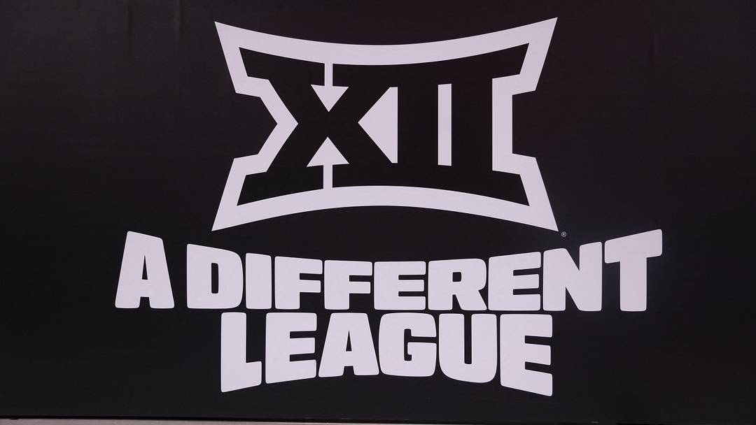 Mar 14, 2026; Kansas City, MO, USA; The Big 12 logo is seen prior to a game between the Arizona Wildcats and the Houston Cougars during the men's Big 12 Conference Tournament Championship at T-Mobile Center. Mandatory Credit: William Purnell Mar 14, 2026; Kansas City, MO, USA; The Big 12 logo is seen prior to a game between the Arizona Wildcats and the Houston Cougars during the men's Big 12 Conference Tournament Championship at T-Mobile Center. Mandatory Credit: William Purnell