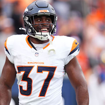 Aug 25, 2024; Denver, Colorado, USA; Denver Broncos running back Audric Estime (37) celebrates his touchdown in the first quarter against the Arizona Cardinals at Empower Field at Mile High. 