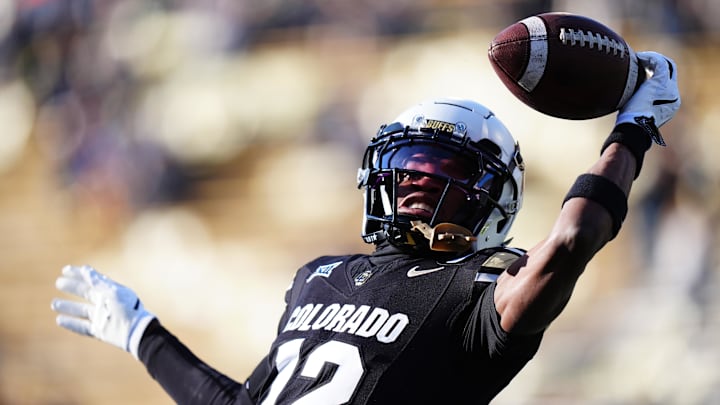 Nov 29, 2024; Boulder, Colorado, USA; Colorado Buffaloes wide receiver Travis Hunter (12) warms up before the game against the Oklahoma State Cowboys at Folsom Field. Mandatory Credit: Ron Chenoy-Imagn Images Nov 29, 2024; Boulder, Colorado, USA; Colorado Buffaloes wide receiver Travis Hunter (12) warms up before the game against the Oklahoma State Cowboys at Folsom Field. Mandatory Credit: Ron Chenoy-Imagn Images