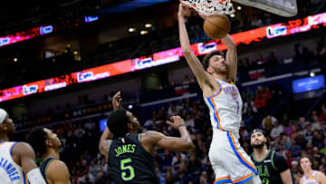 Mar 26, 2024; New Orleans, Louisiana, USA; Oklahoma City Thunder forward Chet Holmgren (7) dunks against New Orleans Pelicans forward Herbert Jones (5) during the first half at Smoothie King Center. Mandatory Credit: Matthew Hinton-Imagn Images