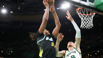 Jan 30, 2024; Boston, Massachusetts, USA; Indiana Pacers center Myles Turner (33) shoots while defended by the Boston Celtics.