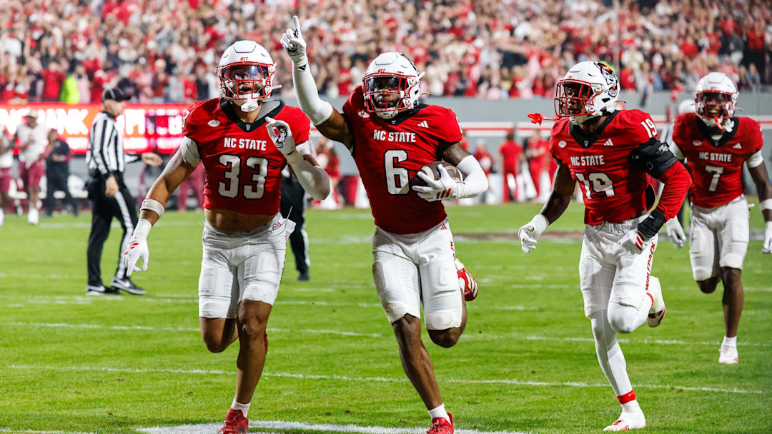 Nov 21, 2025; Raleigh, North Carolina, USA; NC State Wolfpack defensive back Devon Marshall (6) celebrates a down and runs towards the JROTC  to celebrate during the first half of the game against Florida State Seminoles at Carter-Finley Stadium. Mandatory Credit: Jaylynn Nash-Imagn Images