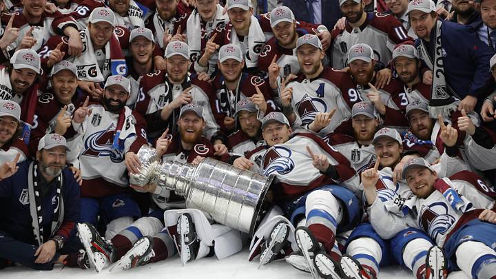 Jun 26, 2022; Tampa, Florida, USA; The Colorado Avalanche pose for a team picture with the Stanley Cup after their game against the Tampa Bay Lightning in game six of the 2022 Stanley Cup Final at Amalie Arena. Mandatory Credit: Geoff Burke-Imagn Images