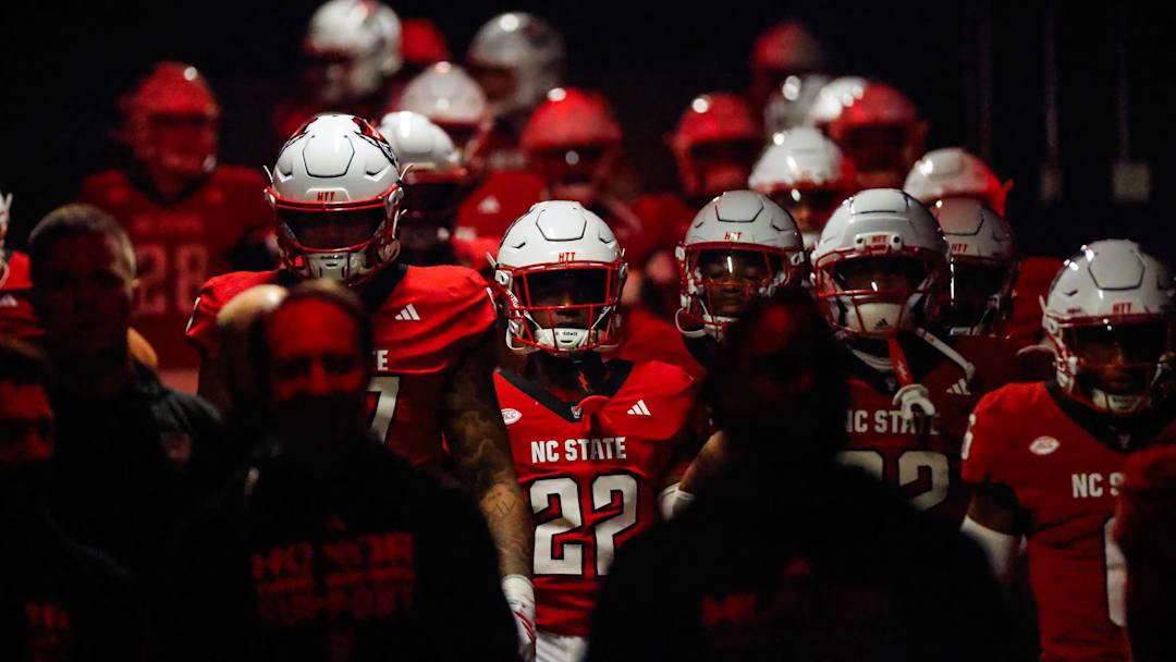 Nov 21, 2025; Raleigh, North Carolina, USA; NC State Wolfpack walk out  prior to the first half of the game against Florida State Seminoles at Carter-Finley Stadium. Mandatory Credit: Jaylynn Nash-Imagn Images