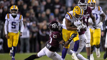 Nov 26, 2022; College Station, Texas, USA; Texas A&M Aggies defensive back Antonio Johnson (27) and LSU Tigers running back Noah Cain (21) in action during the game between the Texas A&M Aggies and the LSU Tigers at Kyle Field. Mandatory Credit: Jerome Miron-USA TODAY Sports