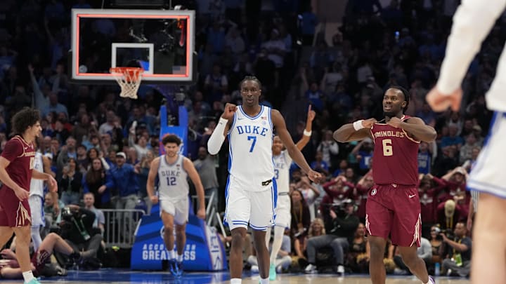 Mar 12, 2026; Charlotte, NC, USA; Duke Blue Devils guard Dame Sarr (7) and Florida State Seminoles guard Robert McCray V. (6) react at the end of the game at Spectrum Center. Mandatory Credit: Bob Donnan-Imagn Images