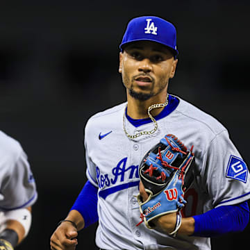 Jul 28, 2025; Cincinnati, Ohio, USA; Los Angeles Dodgers shortstop Mookie Betts (50) runs off the field in the third inning against the Cincinnati Reds at Great American Ball Park. Mandatory Credit: Katie Stratman-Imagn Images