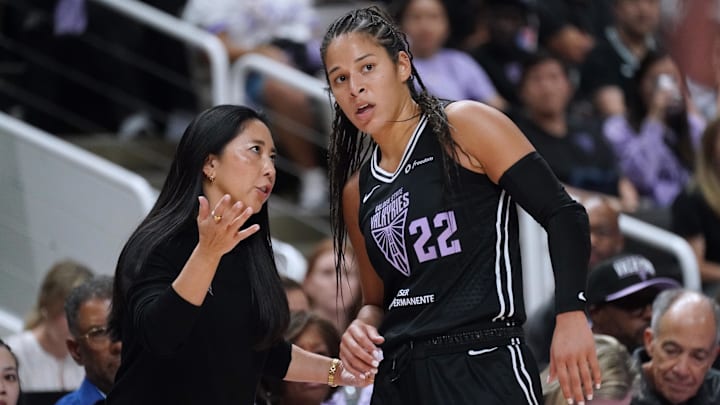 Golden State Valkyries head coach Natalie Nakase talks with guard Veronica Burton (22) in the fourth quarter against the Minnesota Lynx in game two of round one for the 2025 WNBA Playoffs at SAP Center. 