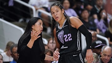 Sep 17, 2025; San Jose, California, USA; Golden State Valkyries head coach Natalie Nakase talks with guard Veronica Burton (22) in the fourth quarter against the Minnesota Lynx in game two of round one for the 2025 WNBA Playoffs at SAP Center. Mandatory Credit: David Gonzales-Imagn Images