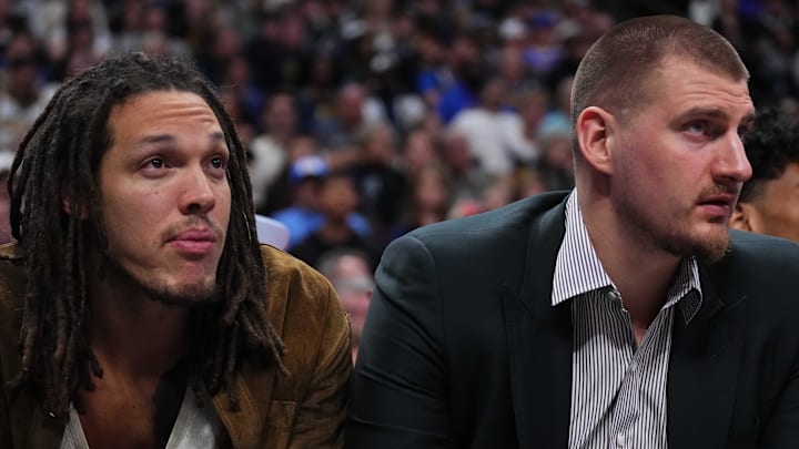 Jan 27, 2026; Denver, Colorado, USA; Denver Nuggets forward Aaron Gordon (32) and center Nikola Jokic (15) on the bench in the second half against the Detroit Pistons at Ball Arena. Mandatory Credit: Ron Chenoy-Imagn Images
