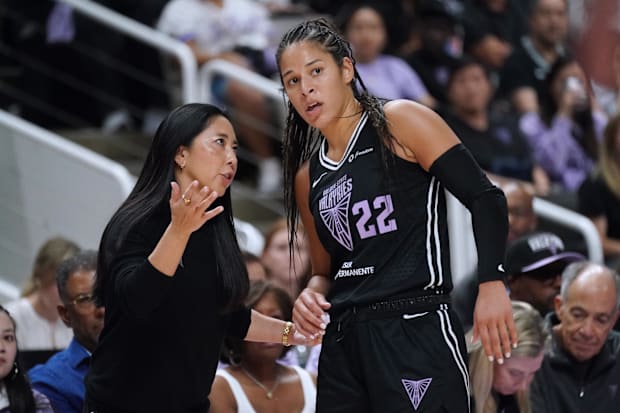 Golden State Valkyries head coach Natalie Nakase talks with guard Veronica Burton. 