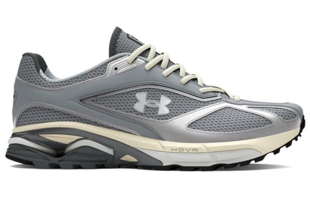 Grey and white Under Armour sneakers.