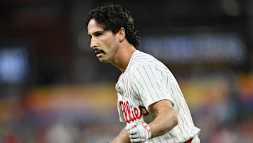 Sep 24, 2024; Philadelphia, Pennsylvania, USA; Philadelphia Phillies catcher Garrett Stubbs (21) reacts after reaching first base safely on an RBI bunt against the Chicago Cubs in the second inning at Citizens Bank Park. Mandatory Credit: Kyle Ross-Imagn Images