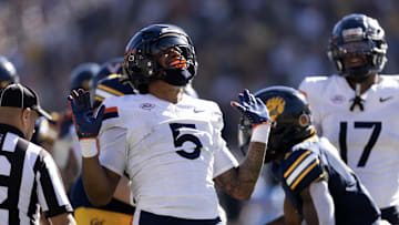 Nov 1, 2025; Berkeley, California, USA; Virginia Cavaliers linebacker Kam Robinson (5) reacts after sacking California Golden Bears quarterback Jaron-Keawe Sagapolutele (not pictured) during the second quarter at California Memorial Stadium. Mandatory Credit: D. Ross Cameron-Imagn Images