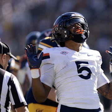 Nov 1, 2025; Berkeley, California, USA; Virginia Cavaliers linebacker Kam Robinson (5) reacts after sacking California Golden Bears quarterback Jaron-Keawe Sagapolutele (not pictured) during the second quarter at California Memorial Stadium. Mandatory Credit: D. Ross Cameron-Imagn Images