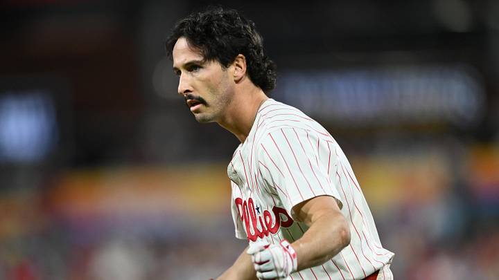Sep 24, 2024; Philadelphia, Pennsylvania, USA; Philadelphia Phillies catcher Garrett Stubbs (21) reacts after reaching first base safely on an RBI bunt against the Chicago Cubs in the second inning at Citizens Bank Park. Mandatory Credit: Kyle Ross-Imagn Images