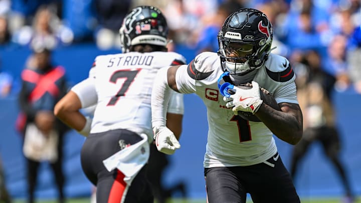 Stefon Diggs, right, scored two touchdowns in his debut with the Texans.