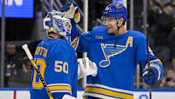 Nov 2, 2024; St. Louis, Missouri, USA;  St. Louis Blues defenseman Colton Parayko (55) and goaltender Jordan Binnington (50) celebrate after the Blues defeated the Toronto Maple Leafs at Enterprise Center. Mandatory Credit: Jeff Curry-Imagn Images