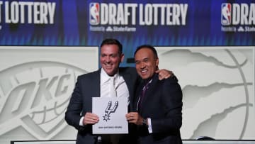 May 16, 2023; Chicago, IL, USA; NBA Deputy Commissioner Mark Tatum (right) congratulates San Antonio Spurs managing partner Peter J. Holt (left) the first pick in the 2023 NBA Draft Lottery at McCormick Place West. Mandatory Credit: David Banks-USA TODAY Sports