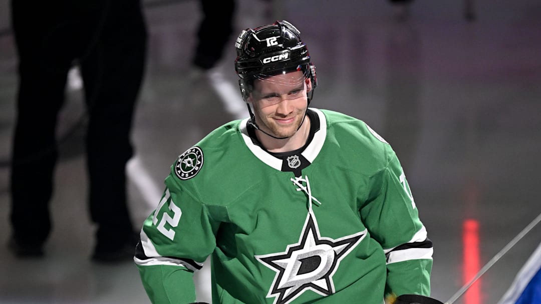 Feb 4, 2026; Dallas, Texas, USA; Dallas Stars center Radek Faksa (12) takes the ice as the Stars celebrate their 2026 Winter Olympics hockey players before the game against the St. Louis Blues at the American Airlines Center. Mandatory Credit: Jerome Miron-Imagn Images