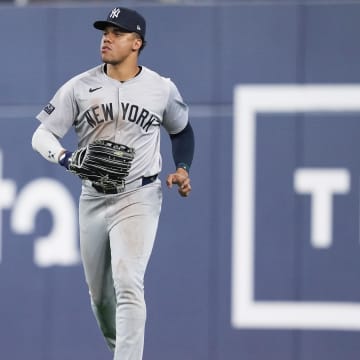 Jun 30, 2024; Toronto, Ontario, CAN; New York Yankees right fielder Juan Soto (22) runs back to the dugout against the Toronto Blue Jays at the end of the eighth inning at Rogers Centre. Mandatory Credit: Nick Turchiaro-USA TODAY Sports