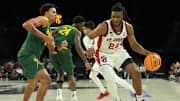 Nov 25, 2025; Las Vegas, Nevada, USA; St. John's Red Storm forward Zuby Ejiofor (24) dribbles the ball against Baylor Bears guard Michael Rataj (12) in a 2025 Players Era Festival group play game at Michelob Ultra Arena. Mandatory Credit: Kirby Lee-Imagn Images