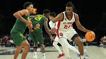 Nov 25, 2025; Las Vegas, Nevada, USA; St. John's Red Storm forward Zuby Ejiofor (24) dribbles the ball against Baylor Bears guard Michael Rataj (12) in a 2025 Players Era Festival group play game at Michelob Ultra Arena. Mandatory Credit: Kirby Lee-Imagn Images