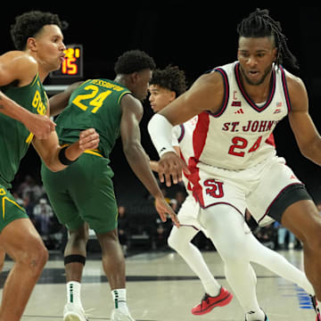 Nov 25, 2025; Las Vegas, Nevada, USA; St. John's Red Storm forward Zuby Ejiofor (24) dribbles the ball against Baylor Bears guard Michael Rataj (12) in a 2025 Players Era Festival group play game at Michelob Ultra Arena. Mandatory Credit: Kirby Lee-Imagn Images