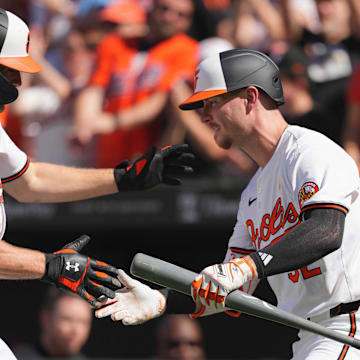 Sep 2, 2024; Baltimore, Maryland, USA; Baltimore Orioles shortstop Gunnar Henderson (left) celebrates his first inning solo home run with first baseman Ryan OíHearn (right) against the Chicago White Sox at Oriole Park at Camden Yards.