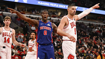 Oct 22, 2025; Chicago, Illinois, USA;  Chicago Bulls center Nikola Vucevic (9)  and Detroit Pistons center Jalen Duren (0) point for possession after a rebound went out of bounds during the second half at United Center. Mandatory Credit: Matt Marton-Imagn Images