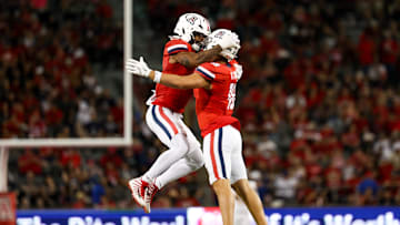 Sep 7, 2024; Tucson, Arizona, USA; Arizona Wildcats linebacker Justin Flowe (0) and Arizona Wildcats linebacker Kamuela Ka'aihue (18) jump in excitement before kickoff during third quarter against Northern Arizona Lumberjacks at Arizona Stadium. Mandatory Credit: Aryanna Frank-Imagn Images
