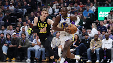 Oct 25, 2024; Salt Lake City, Utah, USA; Golden State Warriors forward Jonathan Kuminga (00) drives against Utah Jazz forward Lauri Markkanen (23) during the first quarter at Delta Center. Mandatory Credit: Rob Gray-Imagn Images