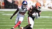 Sep 22, 2024; Cleveland, Ohio, USA; Cleveland Browns wide receiver Jerry Jeudy (3) runs with the ball after a catch as New York Giants cornerback Cor'Dale Flott (28) defends during the second half at Huntington Bank Field. Mandatory Credit: Ken Blaze-Imagn Images