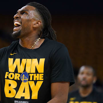 Kevon Looney warms up before a playoff game against the Timberwolves.