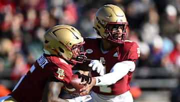 Nov 9, 2024; Chestnut Hill, Massachusetts, USA; Boston College Eagles quarterback Thomas Castellanos (1) hands the ball off to unning back Kye Robichaux (5) during the first half at Alumni Stadium. Mandatory Credit: Brian Fluharty-Imagn Images