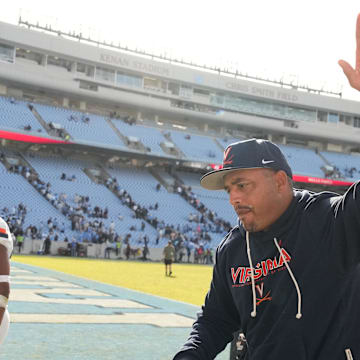 Oct 25, 2025; Chapel Hill, North Carolina, USA; Virginia Cavaliers head coach Tony Elliott runs off the field after defeating the North Carolina Tar Heels in overtime at Kenan Stadium. Mandatory Credit: Bob Donnan-Imagn Images