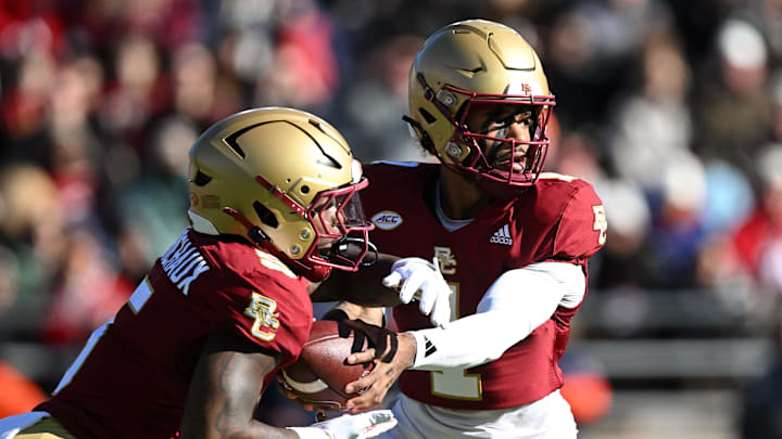 Nov 9, 2024; Chestnut Hill, Massachusetts, USA; Boston College Eagles quarterback Thomas Castellanos (1) hands the ball off to unning back Kye Robichaux (5) during the first half at Alumni Stadium. Mandatory Credit: Brian Fluharty-Imagn Images