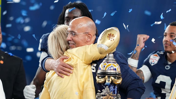 Penn State Nittany Lions head coach James Franklin reacts with the trophy after defeating the Boise State Broncos in the Fiesta Bowl at State Farm Stadium. Penn State Nittany Lions head coach James Franklin reacts with the trophy after defeating the Boise State Broncos in the Fiesta Bowl at State Farm Stadium.