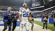 Dec 22, 2024; Indianapolis, Indiana, USA; Indianapolis Colts running back Jonathan Taylor (28) celebrates as he leaves the field after winning a game against the Tennessee Titans at Lucas Oil Stadium. 