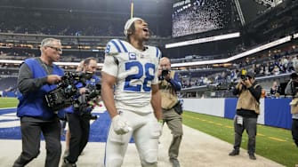 Dec 22, 2024; Indianapolis, Indiana, USA; Indianapolis Colts running back Jonathan Taylor (28) celebrates as he leaves the field after winning a game against the Tennessee Titans at Lucas Oil Stadium. 