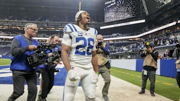 Dec 22, 2024; Indianapolis, Indiana, USA; Indianapolis Colts running back Jonathan Taylor (28) celebrates as he leaves the field after winning a game against the Tennessee Titans at Lucas Oil Stadium. 